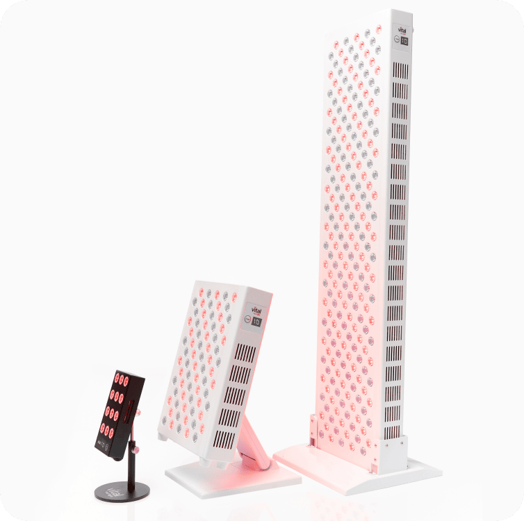 Three LED light therapy devices of varying sizes and designs on display with red and pink lights.